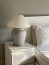 Cloud inspired lamp placed in a minimalist interior setting