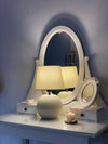 Mellow lamp softly lit in a contemporary Pakistani bedroom