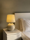 Mellow terracotta lamp in Pakistan with matte beige and black trim