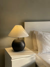 Matte terracotta lamp in Pakistan with gold ring accent