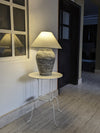 Slate lamp glowing in entryway with rustic home décor accents

