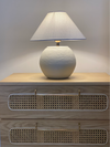 Textured Orb lamp softly lit in neutral-toned Pakistani interior