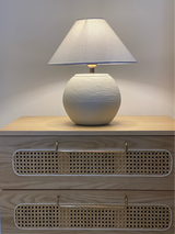 Textured Orb lamp softly lit in neutral-toned Pakistani interior
