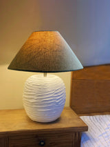 Close-up of handcrafted cream lamp with minimalist texture

